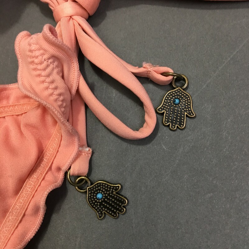 No Brand String Bikini, Peach, Size: S/P lace up front, athletic style top, adjustable spaghetti shoulder  straps,  removeable soft pads, bottom has ruffled edges , ties at sides with 2 small hanging \"hamsa\" amulet hands on either side. Hand wash cold, no bleach, line dry shade. No maker or fabric tags.<br />
3.80 oz