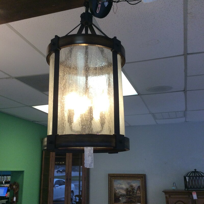 This is a lovely hanging light fixtue. It includes 4 lights and is cylindrical in shape with a bronze colored frame.