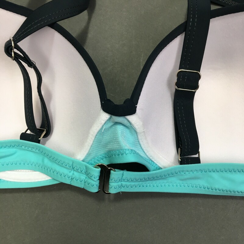 No Brand top soft fixed cups, adjustable shoulder straps, two-toned Aqua and Black top only, hook back, bosom has ruche fabric cups detail and center plastic \"jewel\" button.  Sized as: XL but looks more like an 8/10 C cup<br />
Made in China. HAnd wash cold, no bleach line dry in shade. 82% Polyester 18% elastine spandex.<br />
3.35 oz