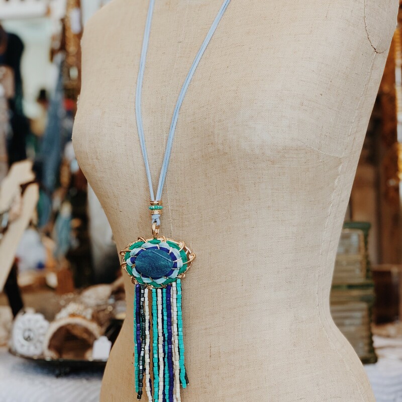 This necklace is such a unique piece! If you love bold and unique jewelry, this is the necklace for you! Avalible in blue tones or nuetral brown tones! Measuring 24 inches long including the stone tassle pendant.
