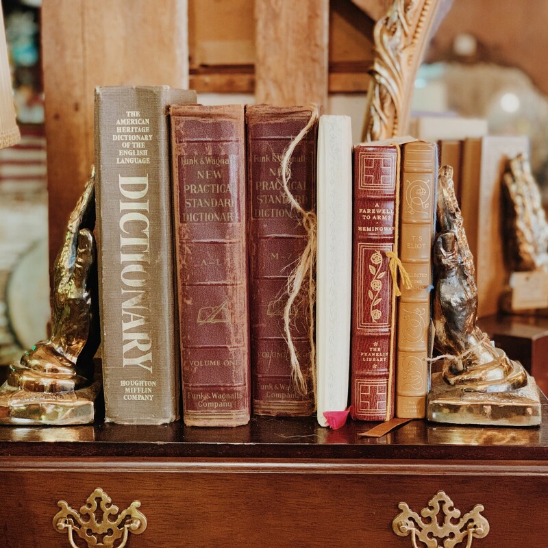 These sturdy hand statues work perfectly as vintage bookends! They measure 9 inches tall.