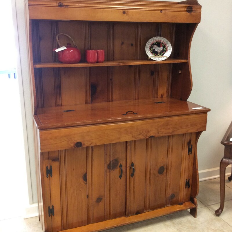 This knotty pine dry sink is really cool. It provides plenty of storage space!