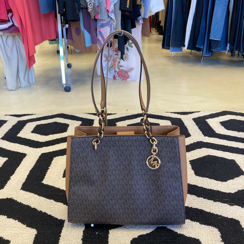 This Michael Kors satchel has logo-print canvas with  100% leather & Gold-tone hardware.
This bag has two inside pockets with a middle zip compartment
Lining: 100% polyester
This bag is in great consition