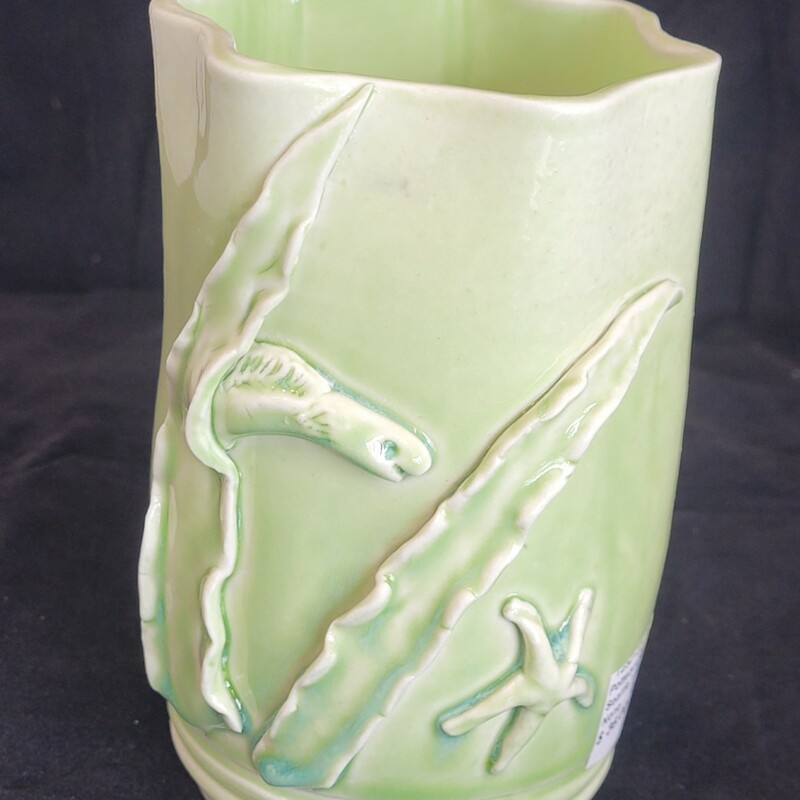 Artist: Pam Gray
Title: Sealife Vase
Thrown and altered porcelain light green vase with raised sealife design.
4x4x6