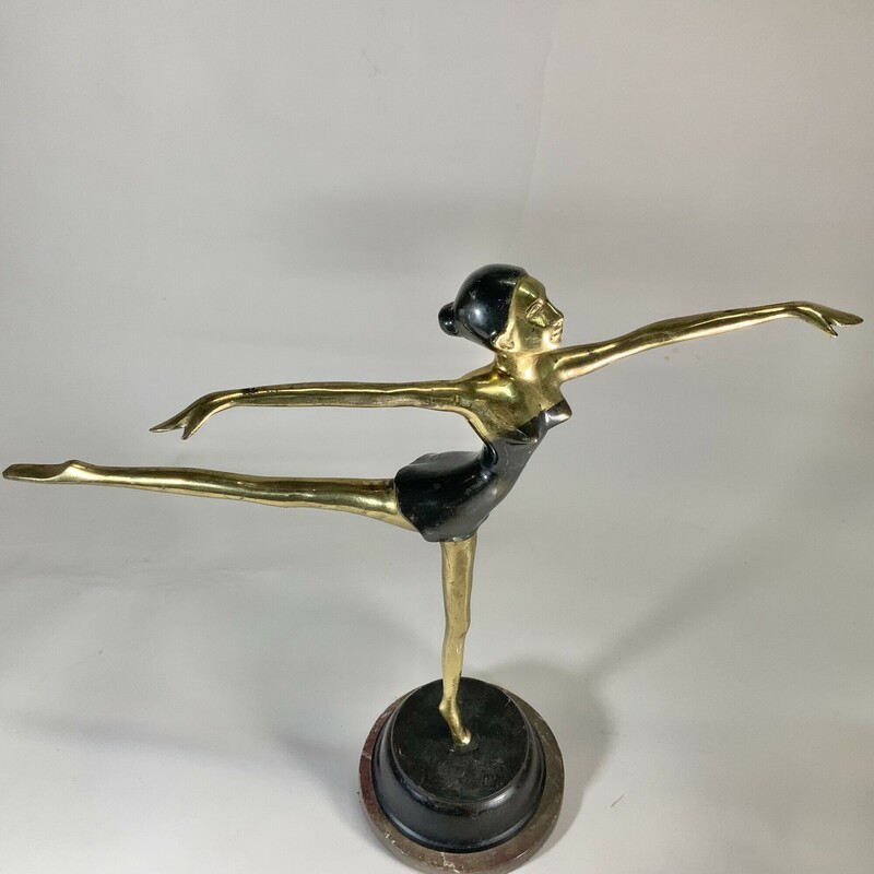 An elegant vintage brass and marble statue depicting a ballerina. This piece is so graceful and would look great on a mantle or a bookcase. Good condition; shows some wear. 18.5 inches high