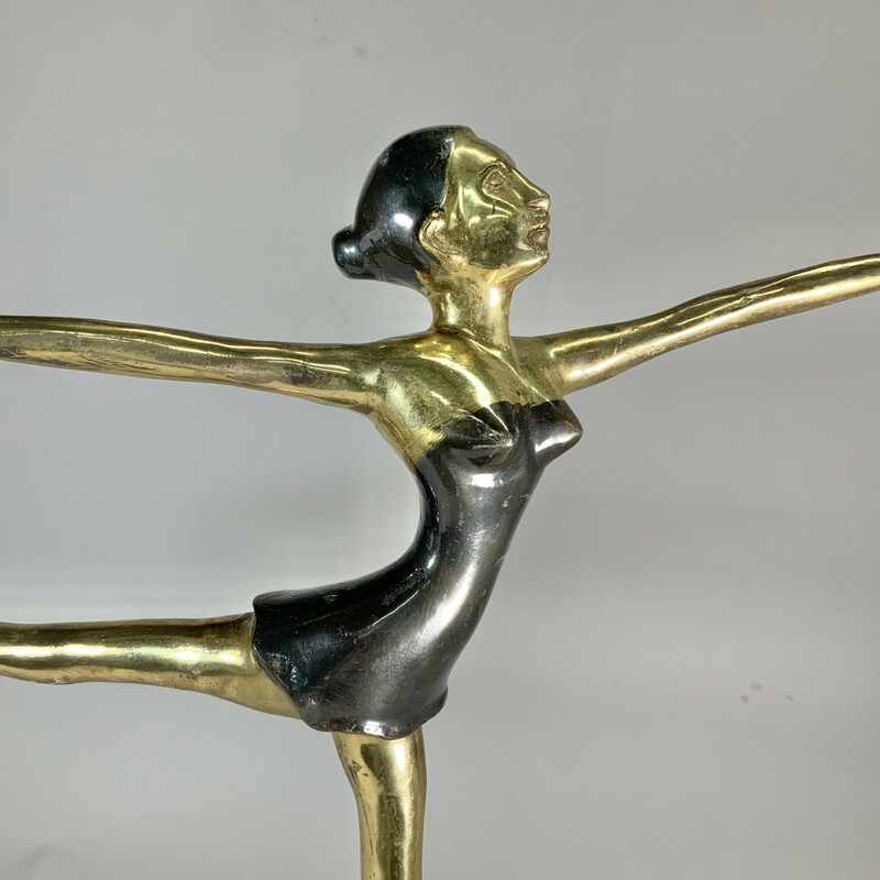 An elegant vintage brass and marble statue depicting a ballerina. This piece is so graceful and would look great on a mantle or a bookcase. Good condition; shows some wear. 18.5 inches high