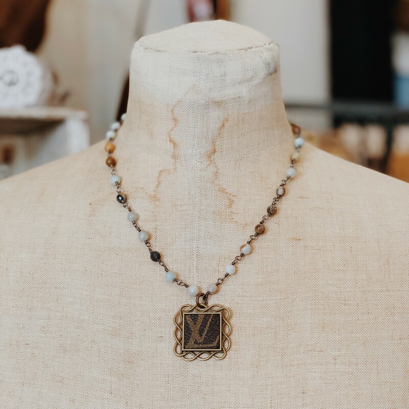 This gorgeous upcycled, handmade necklace was made from an authentic Louis Vuitton bag!

The chain measures 19.5 inches in length.

Resurrect Antiques is not affiliated with the LV company.
The bag's date code is SP0927