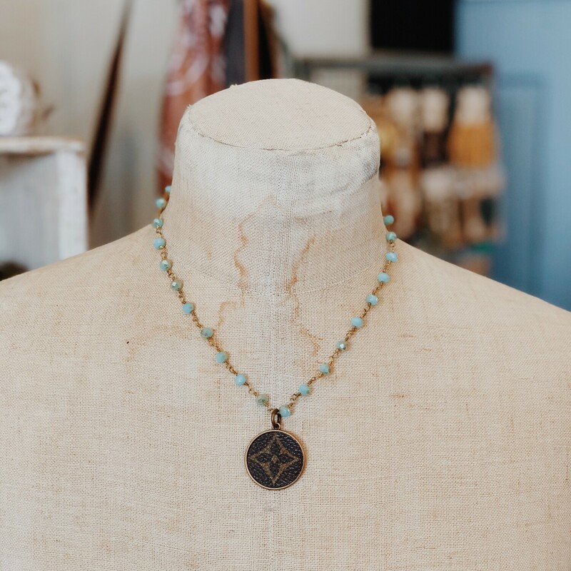 This gorgeous upcycled, handmade necklace was made from an authentic Louis Vuitton bag!

The chain measures 17 inches in length.

Resurrect Antiques is not affiliated with the LV company.
The bag's date code is SP0927