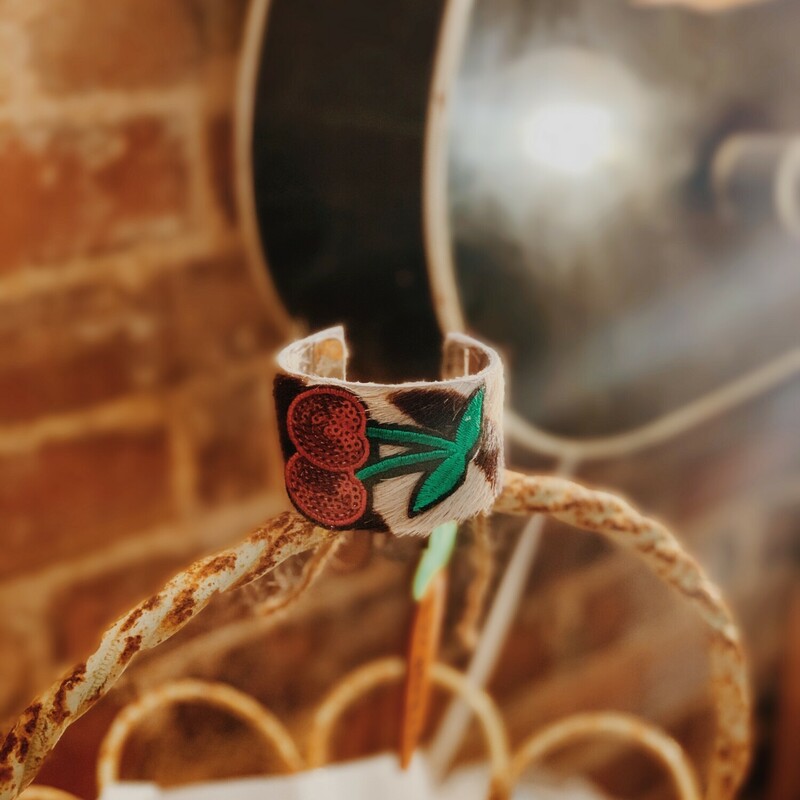 This absolutely adorable and handmade cuff is truly one of a kind! It measures 2.5 inches in diameter and 1.5 inches tall.
