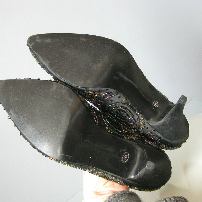 Stunning pair of heels by Impo<br />
<br />
Black satin with multi-color iridescent beading<br />
Size 7.5<br />
Worn once, perfect condition<br />
<br />
These are stiff-ish shoes.  True to size but will not be forgiving to larger feet.<br />
<br />
<br />
Heel : 3<br />
<br />
thanks for looking!<br />
#45527