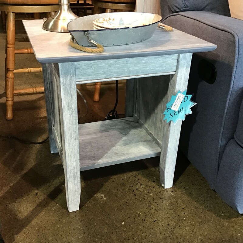 Fit this chairside farmstyle end table beside a recliner or lounge seat for convenient storage and display space.  This brand new end table features a charging station which includes two standard outlets and two USB ports which can easily charge your phone, tablet and even your laptop. .

Dimensions20x20x22