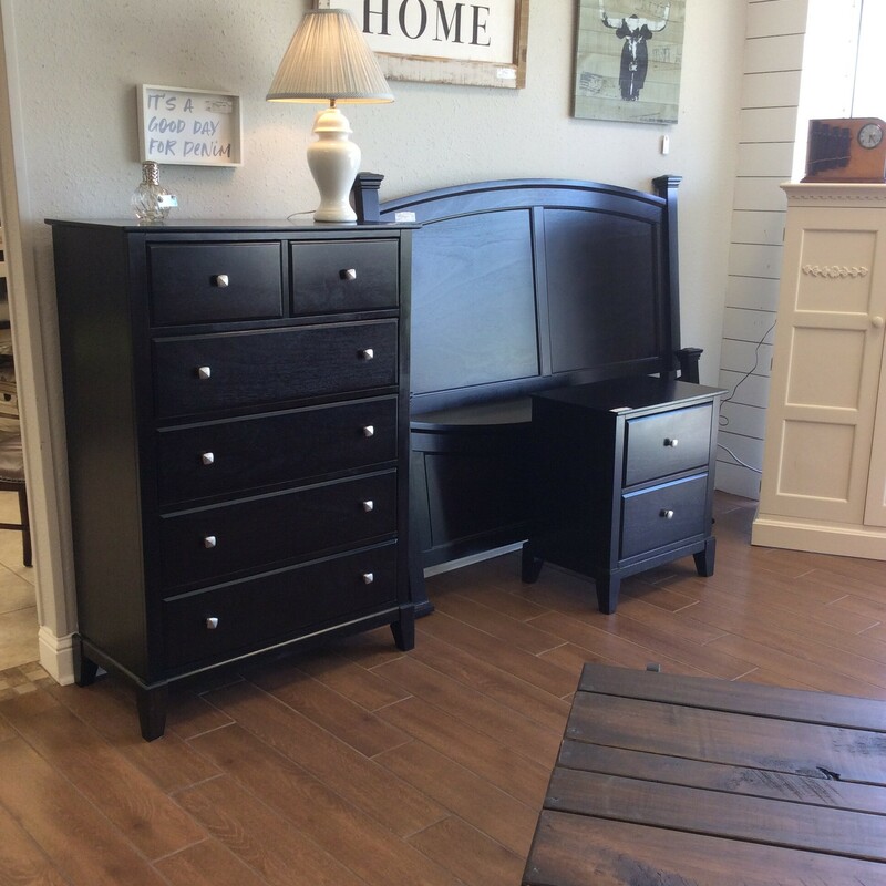 This set by Ashley Furniture includes a headboard, footbboard, chest and nightstand. The bed is queen-sized. It has a dark wood stain and chrome hardware.