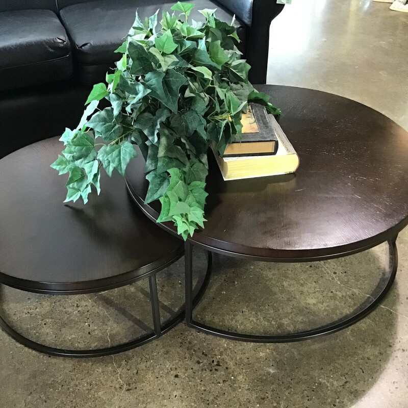 These wood & metal round nesting coffee tables is an ingenious use of space! They have an industrial vibe to them and the smaller table completely fits under the larger one if you are space-challenged. There is a small place on the top table where the veneer has been pulled away and there is a slight bubbling. The price of $299.99 reflects this imperfection, as coffee tables on this website sell for over $1500!
Larger Table Dimensions - 35-1/2 in x 15 in
Smaller Table Dimensions - 28-1/2 in x 12 in
