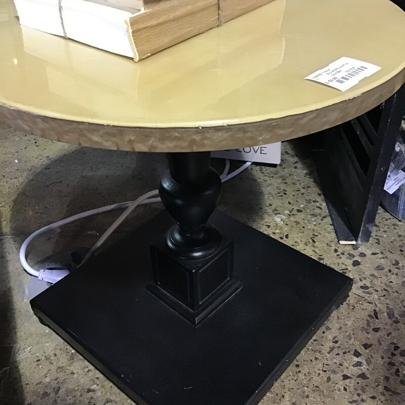 A unique round cream and black accent table featuring a beveled edge around the top. The top is a  deep cream and the square base is a  rich black. This table is great for a formal or taditional style. Perfect for a living room or bedroom in need of a small accent table.

Dimensions:
18 in x 18.5 in