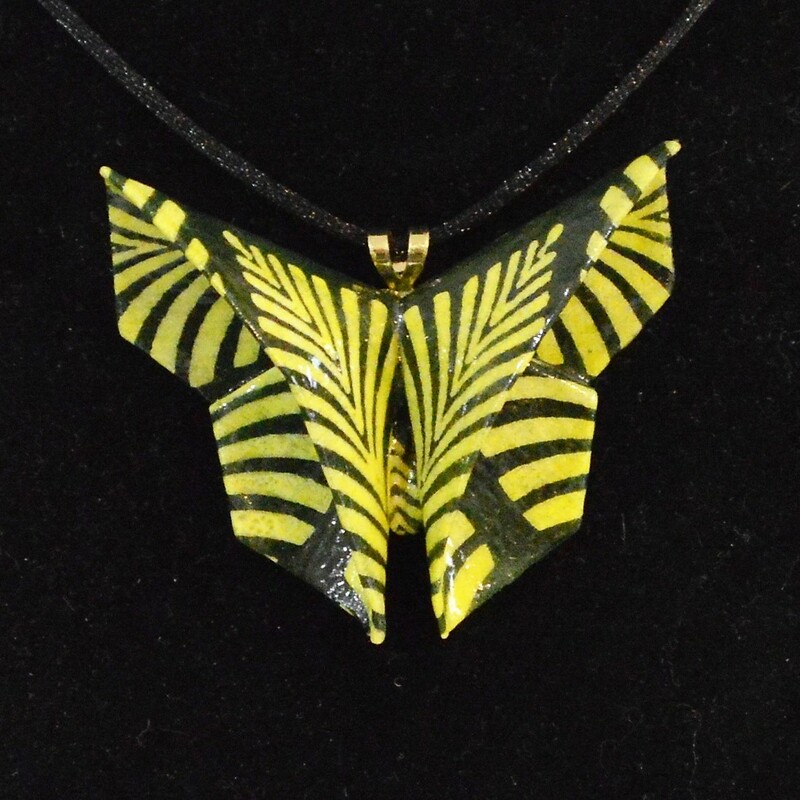 Rich Gray
Paper 2 x 2.5
Black and Yellow Origami Butterfly Necklace
Origami butterfly folded of lokta paper from Nepal and coated with clear acrylic sealants for durability.  18 inch black cord
