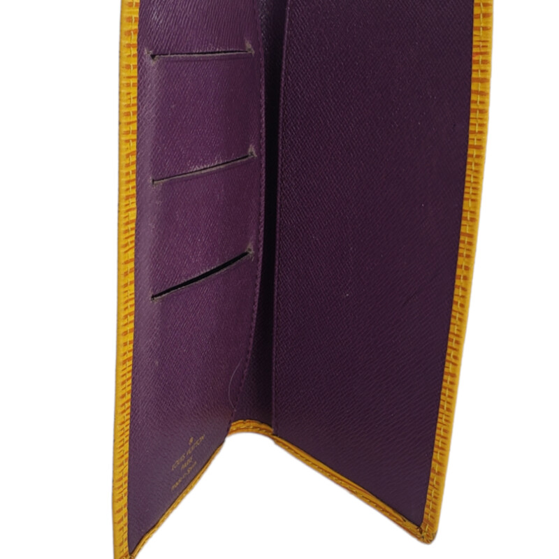 Louis Vuitton<br />
<br />
Epi Leather  Check Card<br />
<br />
Yellow, Purple Interior<br />
<br />
Condition: Good. Wear aroung corners and card slots