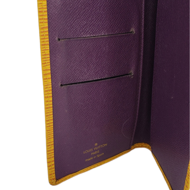 Louis Vuitton<br />
<br />
Epi Leather  Check Card<br />
<br />
Yellow, Purple Interior<br />
<br />
Condition: Good. Wear aroung corners and card slots