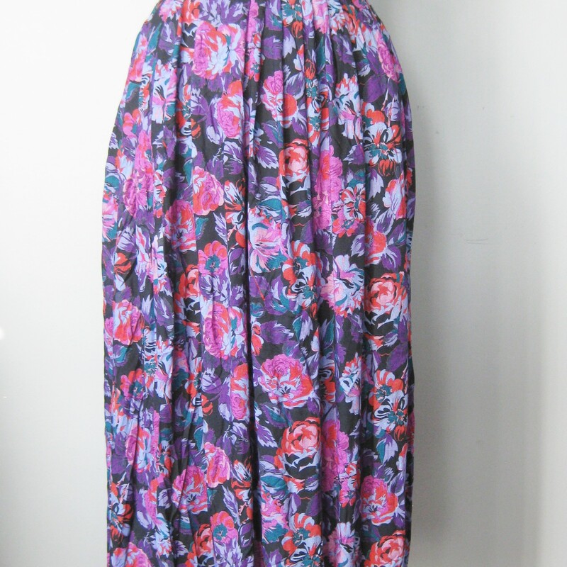 This is a pretty flowy skirt from the early 80s or maybe even the 70s<br />
Made of rayon, it has a wide waist band and a center back zipper.<br />
unlined<br />
Pretty floral print in pnks and purples, quite full and drapes nicely<br />
Made in the USA by Emily St. John<br />
Marked size 7-8 - but use measurements below<br />
Flat measurements:<br />
waist:  13<br />
hip 22.5<br />
length: 30.5<br />
excellent condition<br />
<br />
Thanks for looking!<br />
#5441