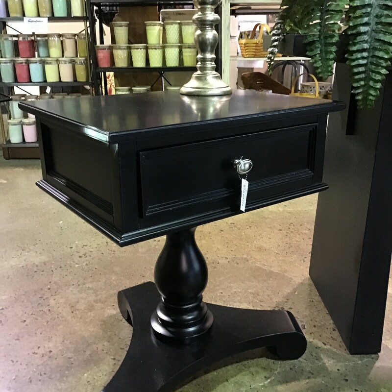 This smaller-scale side table is finished in black stain and features 1 drawer. It would be great in between 2 chairs, next to a loveseat or sofa or even as a bedside table.
Dimensions are 21 in x 17 in x 24 in