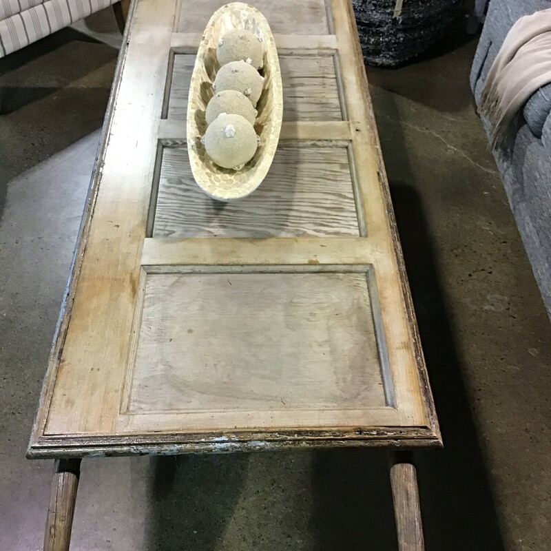 This awesome one-of-a-kind piece was handcrafted by one of our local artists. He used an antique industrial cart and added a vintage door to the top to make the coolest coffee table! This table would be the perfect addition to any family room, game room or mancave!
Dimensions are 68 in x 25 in x 19 in
