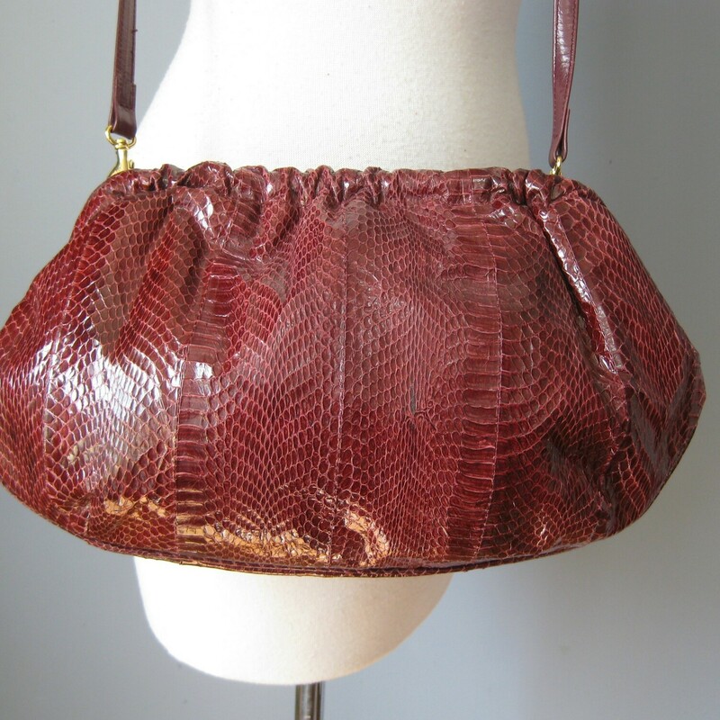 J Rene Snakeskin, Red, Size: None<br />
J Renee puffy snakeskin purse works for day or night.  Burgundy snakeskin hinged clutch with a detachable crossbody strap.  Never Worn, original department store tags inside<br />
<br />
Measurements:<br />
Width: 14.5<br />
Height: 8.25<br />
Depth: aprox. 4 1/2<br />
Strap Drop: 19<br />
<br />
Thanks for looking!<br />
<br />
#42154