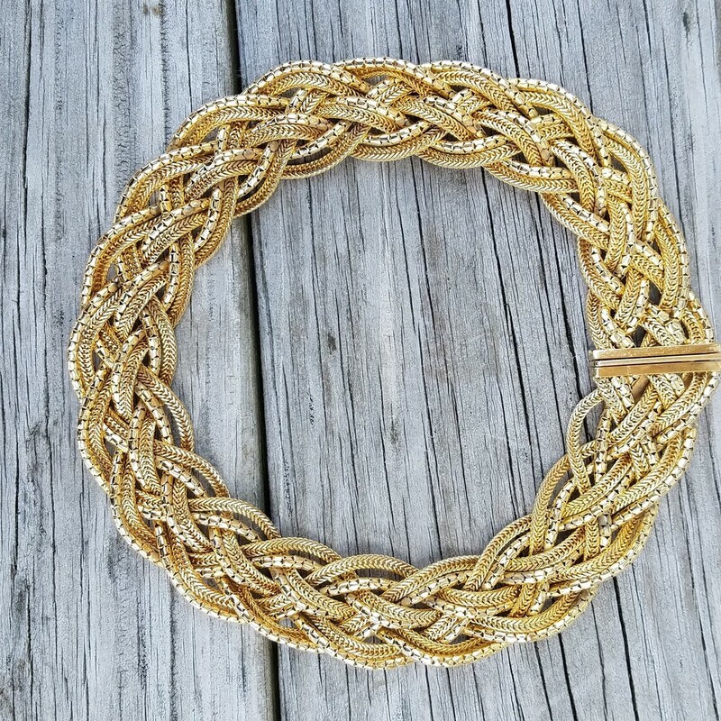 Vintage 1967 Christian Dior Braided necklace in gold plate. This heritage necklace combines matte and polished strands that are braided together.  10 individual strands that are aprox 16 inches, width 3/4 inch with a box clasp closure. Maybe worn a few times, minor wear to the plating on the underside of the clasp which is not visible when worn. Stamped CHR DIOR 1967, Made in Germany.<br />
<br />
Henkel and Grossé specialized in gold-colored metal pieces, but for Dior, they produced highly elaborate rhinestone sets of jewelry as well. All of their jewelry was handmade.<br />
In the 1960s, ‘Chr.Dior’, a copyright symbol and the year of manufacture was marked onto the pieces.<br />
The 1970s and 1980s pieces by Henkel and Grossé were produced in higher number than their 50s counterparts and are therefore easier to find.<br />
RARE FIND indeed
