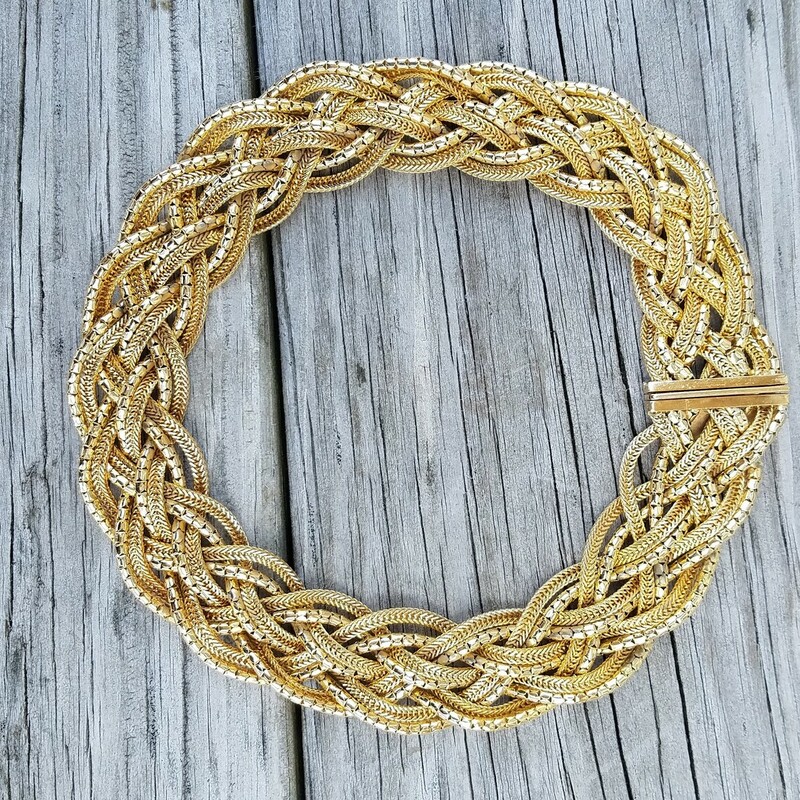 Vintage 1967 Christian Dior Braided necklace in gold plate. This heritage necklace combines matte and polished strands that are braided together.  10 individual strands that are aprox 16 inches, width 3/4 inch with a box clasp closure. Maybe worn a few times, minor wear to the plating on the underside of the clasp which is not visible when worn. Stamped CHR DIOR 1967, Made in Germany.<br />
<br />
Henkel and Grossé specialized in gold-colored metal pieces, but for Dior, they produced highly elaborate rhinestone sets of jewelry as well. All of their jewelry was handmade.<br />
In the 1960s, ‘Chr.Dior’, a copyright symbol and the year of manufacture was marked onto the pieces.<br />
The 1970s and 1980s pieces by Henkel and Grossé were produced in higher number than their 50s counterparts and are therefore easier to find.<br />
RARE FIND indeed