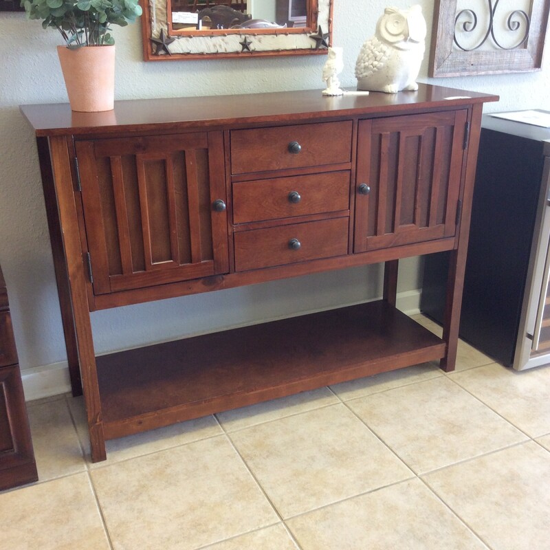This 2-tier console/buffet  features a dark wood finish and is modern in design. It includes 3 drawers and 2 cabinets.