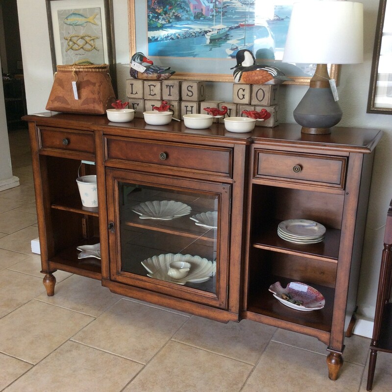 This buffet/media cabinet has a cherrywood finish and includes drawers with dovetail jointing and adjustable shelving.