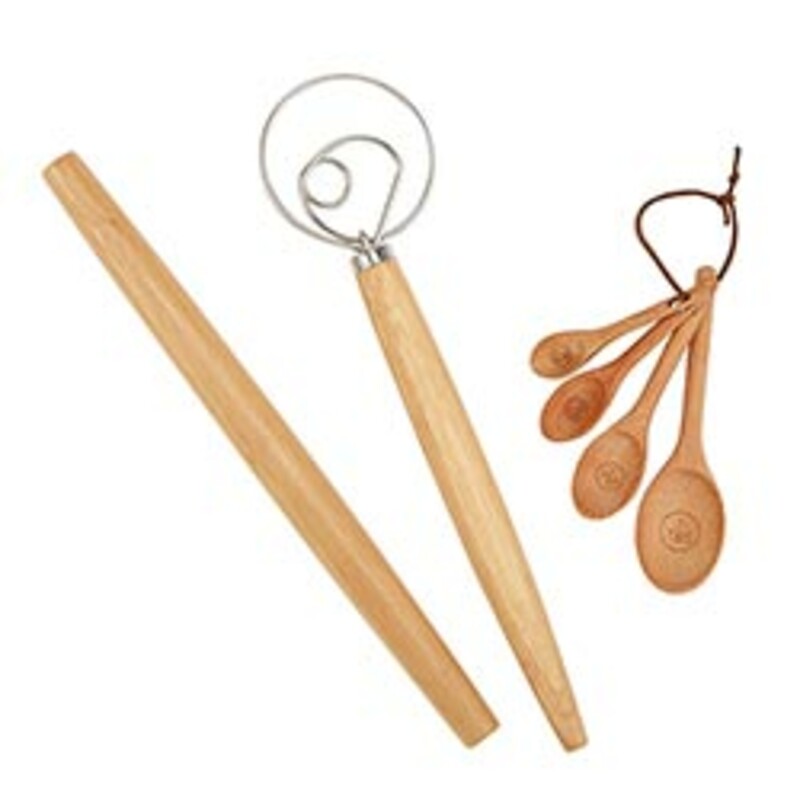 A set of measuring spoons, French dough whisk and rolling pin packaged in a unique book box and tied with a cute ribbon makes for a great gift to give!