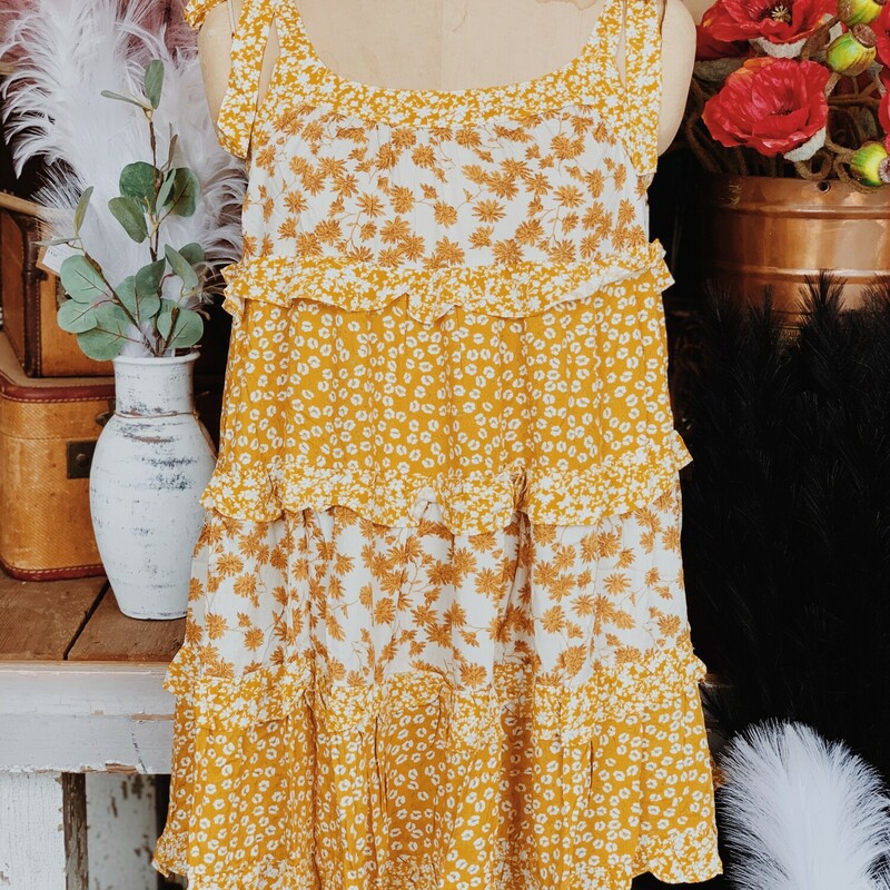 This flouncy, floral dress is perfect to throw on and go! Pair it with a white tee underneath in the spring time or wear it on its own in the summer! Its light weight and breathability makes it the perfect go to, and it will have you looking dolled up and put together!