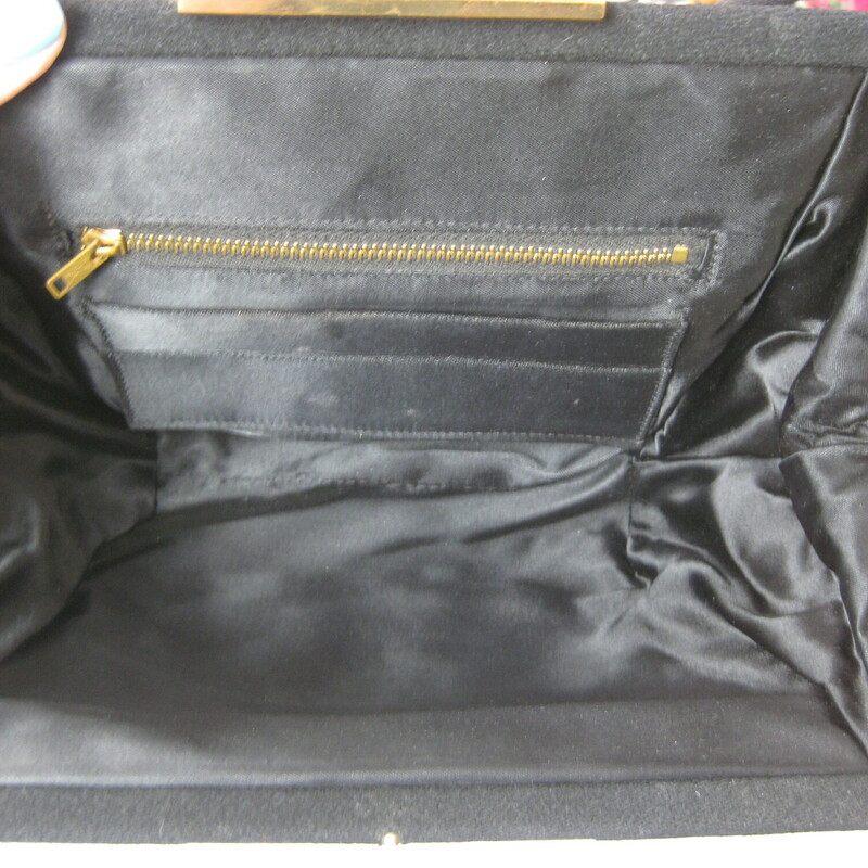 Matte Black, squashy woollen bag with a goldm etal frame and a tilt clasp. It's kind of girly and witchy at the same time.
No Tags
Satin lining
Metal zipper pocket
Excellent condition.
Width: 10
Height: 7
Depth: 3
Handle drop: 7 1/4

Thanks for looking!
#43470