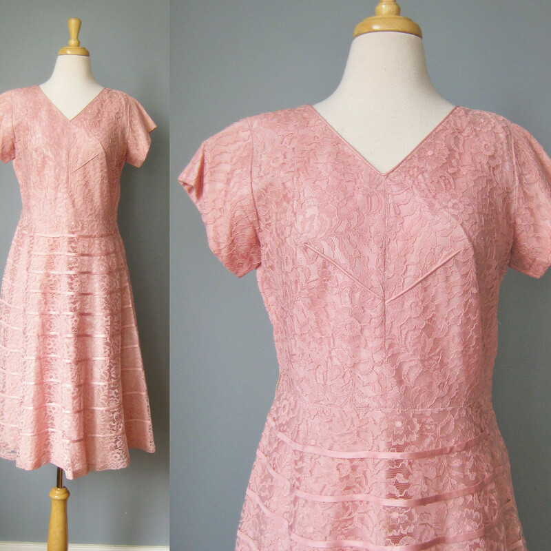 early 1950s Pink Lace Evening Dress -  a classic!

The design features a high cut v  neck line and capped sleeves.  The skirt and the chest are decorated with some horizontal and diagonal satin lines. Keeps the sweetness in check a bit. The skirt is quite full.    The dress has a metal side zipper.
no tags

Excellent condition!
Should fit a modern size 10 or 12 person
Flat Measurements:
Armpit to Armpit: 20
Waist: 16 1/2
Hips: 23
Length: 43.5

Thanks for looking!
#37742