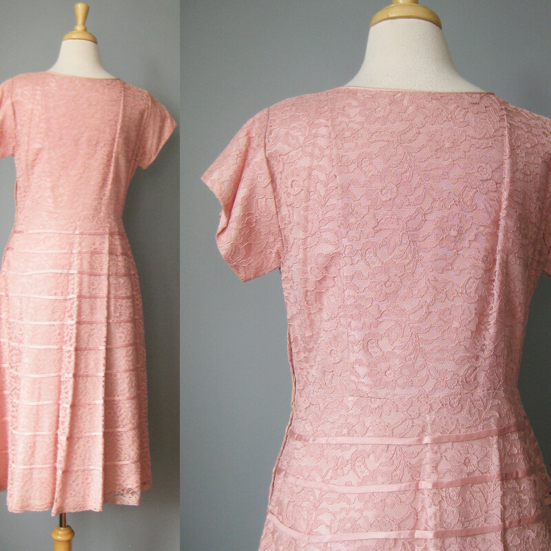 early 1950s Pink Lace Evening Dress -  a classic!

The design features a high cut v  neck line and capped sleeves.  The skirt and the chest are decorated with some horizontal and diagonal satin lines. Keeps the sweetness in check a bit. The skirt is quite full.    The dress has a metal side zipper.
no tags

Excellent condition!
Should fit a modern size 10 or 12 person
Flat Measurements:
Armpit to Armpit: 20
Waist: 16 1/2
Hips: 23
Length: 43.5

Thanks for looking!
#37742