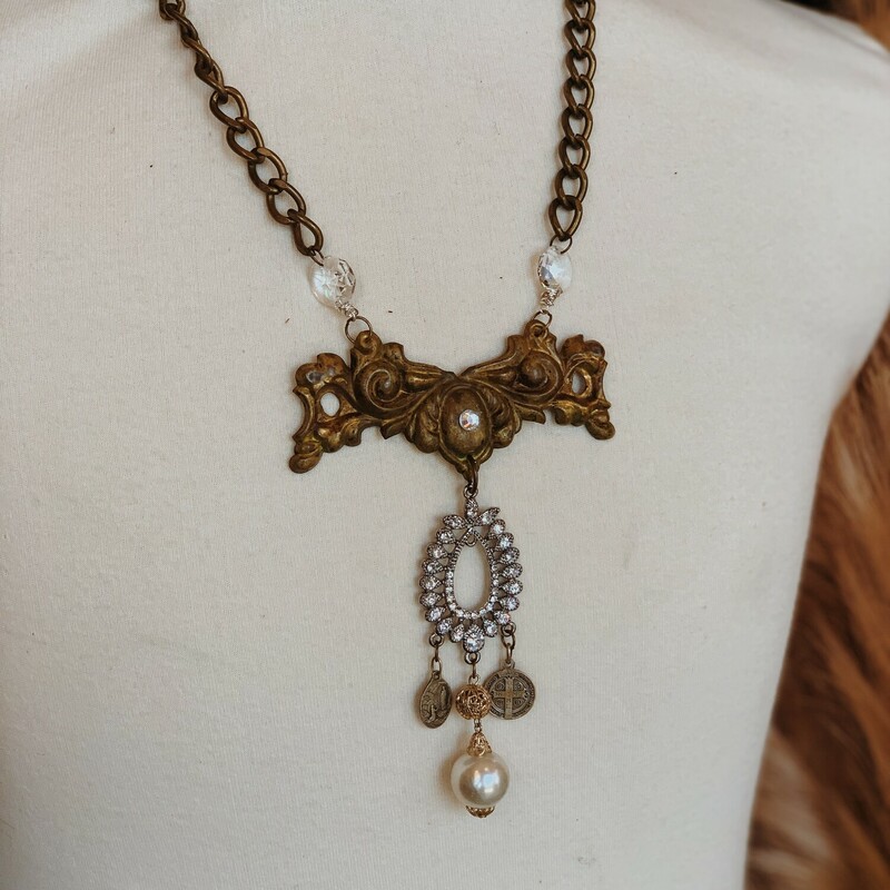 This gorgeous, one of a kind necklace handmade by Kelli Hawk Designs is on a 23 inch brass chain and was made from a collention of vintage pieces!