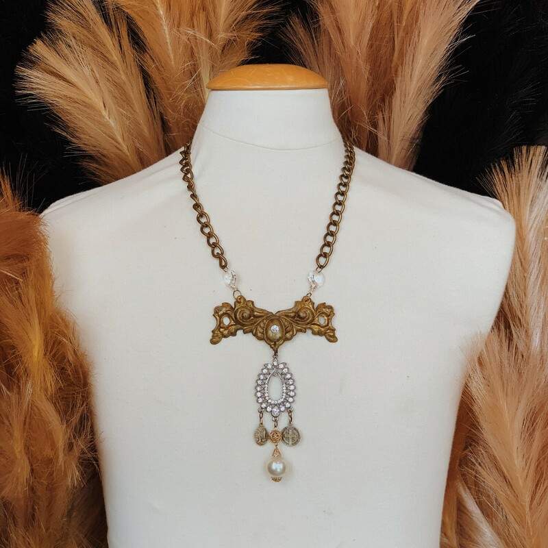 This gorgeous, one of a kind necklace handmade by Kelli Hawk Designs is on a 23 inch brass chain and was made from a collention of vintage pieces!