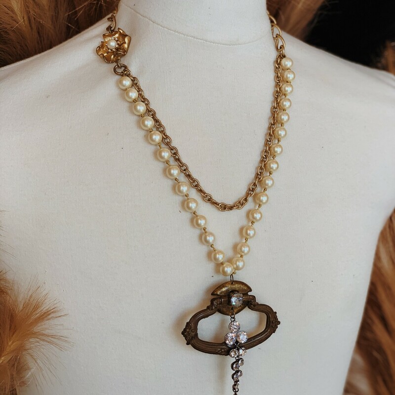 This gorgeous necklace by Kelli Hawk Designs is on a 22 inch chain and features an assortment of different vintage pieces!