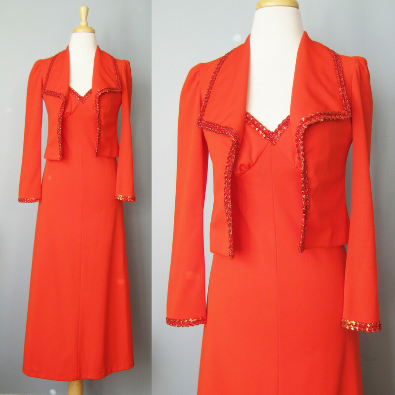 Bright Red prom dress from the 1970s.
This outfit consists of a spaghetti strap gown with a fitted top trimmed in sequins
The jacket is waist length, long sleeved and has the same trim

The size tag says size 7 but WILL NOT fit a modern size 7.  My mannequin is about a size 4 and this dress will not zip all the way up on it so, figure this for a size 0 -2,  also better for a slim woman or girl who is buying junior sizes.

Here are the flat measurements, please double where appropriate:

DRESS:
Armpit to armpit: 17.5
Waist: 13.25
Hip: 19
Length: 52.5

JACKET:
Shoulder to shoulder: 13
Armpit to armpit: 16
Underarm sleeve seam length: 18.25
Length: 17
condition: excellent, there is a vanishingly faint shadow on the front of the dress and a darker smudge which is hidden by the turn of the collar of the jacket as shown., so it won't be seen when

Thanks for looking!
#38876
