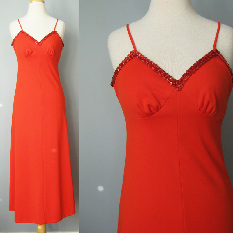 Bright Red prom dress from the 1970s.<br />
This outfit consists of a spaghetti strap gown with a fitted top trimmed in sequins<br />
The jacket is waist length, long sleeved and has the same trim<br />
<br />
The size tag says size 7 but WILL NOT fit a modern size 7.  My mannequin is about a size 4 and this dress will not zip all the way up on it so, figure this for a size 0 -2,  also better for a slim woman or girl who is buying junior sizes.<br />
<br />
Here are the flat measurements, please double where appropriate:<br />
<br />
DRESS:<br />
Armpit to armpit: 17.5<br />
Waist: 13.25<br />
Hip: 19<br />
Length: 52.5<br />
<br />
JACKET:<br />
Shoulder to shoulder: 13<br />
Armpit to armpit: 16<br />
Underarm sleeve seam length: 18.25<br />
Length: 17<br />
condition: excellent, there is a vanishingly faint shadow on the front of the dress and a darker smudge which is hidden by the turn of the collar of the jacket as shown., so it won't be seen when<br />
<br />
Thanks for looking!<br />
#38876