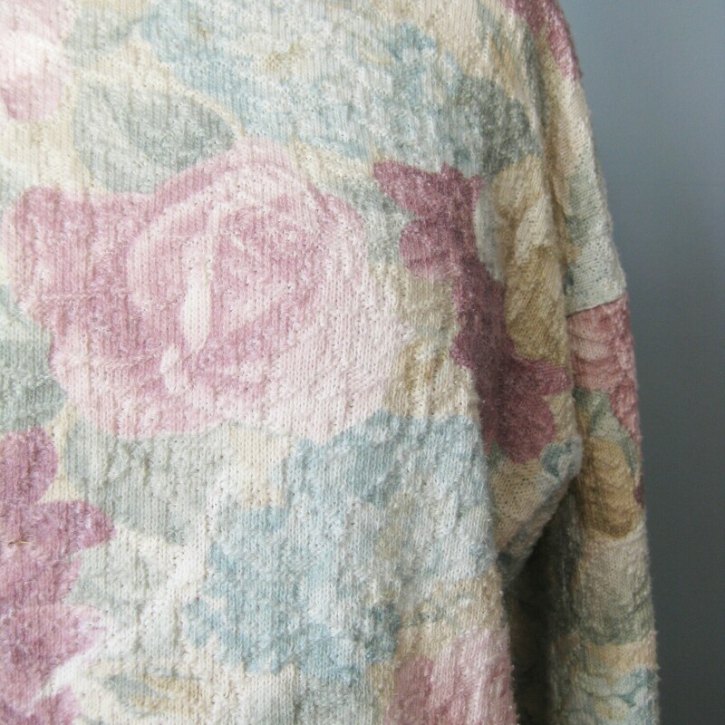 romantic vintage sweater in a pink and green pastel floral pattern<br />
by Partners textured and tunic length.<br />
excellent condition, no flaws<br />
cozy and cute<br />
flat measurements:<br />
armpit to armpit: 21.5<br />
length:25<br />
width at hem: 21<br />
50/50 cotton poly blend with a bit of stretch<br />
<br />
thanks for looking!<br />
#41290
