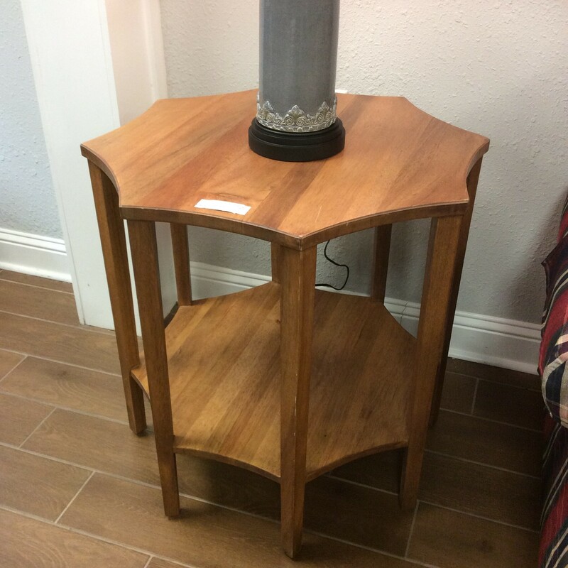 This side/occasional table is unique! 7-sided and features a dark wood finish.