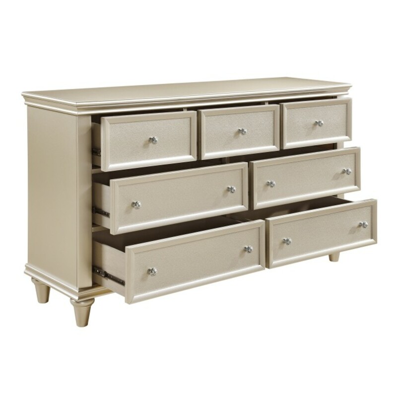Celandine Dresser

Items purchased online will ship to our store, drop shipping options may be available.

Please contact us at 509-928-9090 if you have any questions and to check on availablity on items.

This is a new item and one of many pieces we can order from Homelegance, they have a variety of options to choose from.

The look of traditional design is updated for the modern traditional home in the Celandine Collection. The high polished knob hardware stands out from the silver finish of the dresser. With each of the aforementioned elements, subtle glamour will be achieved in the design of your elegant bedroom.

Overall Dimension: 62.25 x 17 x 36.5H

Made of wood and engineered wood
Silver finish
Embossed, textural drawer fronts
7 dovetail drawers with ball bearing glides
Polished chrome tone knobs