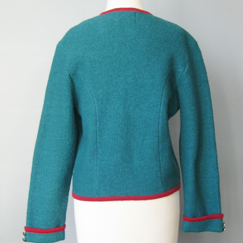 Nice warm cardigan by Tally Ho.<br />
It's boiled wool with interesting details<br />
Round silver metal buttons<br />
Red contrast trim, notched hemline<br />
100% wool<br />
Excellent condition<br />
Marked Size 6, but better for a modern size medium.<br />
Here are the flat measurements, please double where appropriate:<br />
shoulder to shoulder: 17.5<br />
Armpit to armpit: 20<br />
width at hem when buttoned: 17.25<br />
underarm sleeve seam: 16<br />
Overall length: 20.25<br />
<br />
Thanks for looking!<br />
#42041