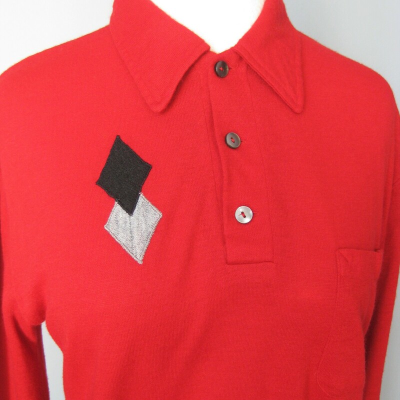 Cool bright red vintage shirt with a black and gray diamond applique decoration on the right side of the chest and a pocket on the left side.  Long Sleeves with a pointy collar and three buttons at the neck.  Button cuffs

By Charles Dobbs


No fabric tags.  It feels like soft felty acrylic, not a knit, no stretch to speak of, lightweight.

The style is masculine but it's small so make sure these measurements will work for you.

shoulder to shoulder: 17.75
armpit to armpit: 19.5
width at hem: 18.75
underarm sleeve seam: 19.25
length: 25

excellent condition!
thanks for looking!
#41307