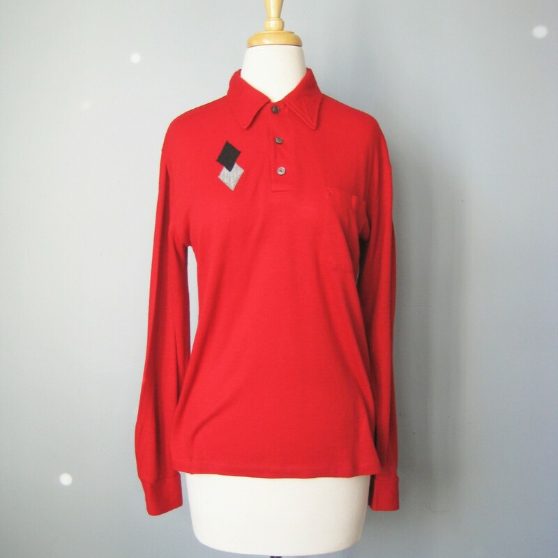 Cool bright red vintage shirt with a black and gray diamond applique decoration on the right side of the chest and a pocket on the left side.  Long Sleeves with a pointy collar and three buttons at the neck.  Button cuffs<br />
<br />
By Charles Dobbs<br />
<br />
<br />
No fabric tags.  It feels like soft felty acrylic, not a knit, no stretch to speak of, lightweight.<br />
<br />
The style is masculine but it's small so make sure these measurements will work for you.<br />
<br />
shoulder to shoulder: 17.75<br />
armpit to armpit: 19.5<br />
width at hem: 18.75<br />
underarm sleeve seam: 19.25<br />
length: 25<br />
<br />
excellent condition!<br />
thanks for looking!<br />
#41307