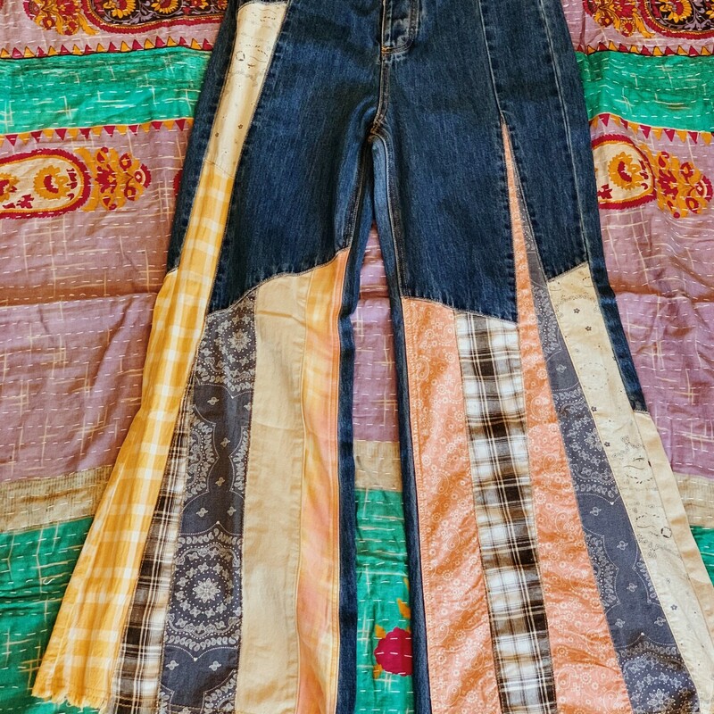 These patchwork jeans are absolutely fabulous! Worked into the denim is an assortment of plaid and paisley patterned fabrics!<br />
Note: These jeans do run small. See measurements below.<br />
<br />
Small Waist: 26 (Inches)<br />
Medium Waist: 28 (Inches)<br />
Large Waist: 30 (Inches)