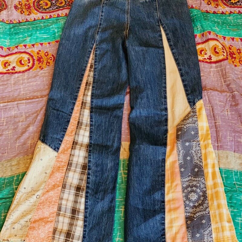 These patchwork jeans are absolutely fabulous! Worked into the denim is an assortment of plaid and paisley patterned fabrics!<br />
Note: These jeans do run small. See measurements below.<br />
<br />
Small Waist: 26 (Inches)<br />
Medium Waist: 28 (Inches)<br />
Large Waist: 30 (Inches)