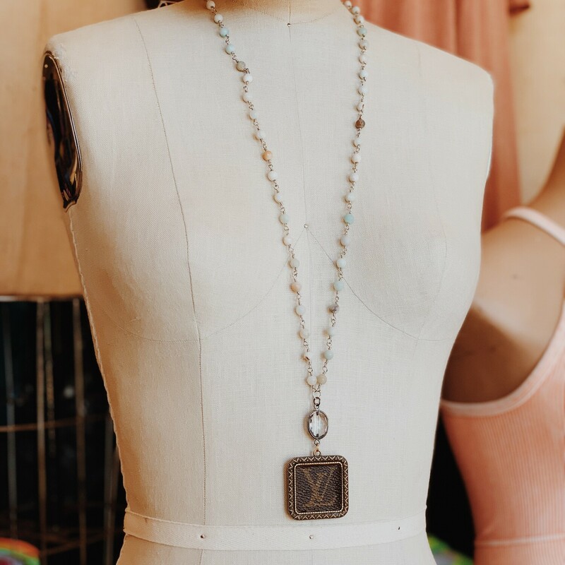 This gorgeous upcycled, handmade necklace was made from an authentic Louis Vuitton bag!

The chain measures 32 inches in length.

Resurrect Antiques is not affiliated with the LV company.
The bag's date code is SP0927