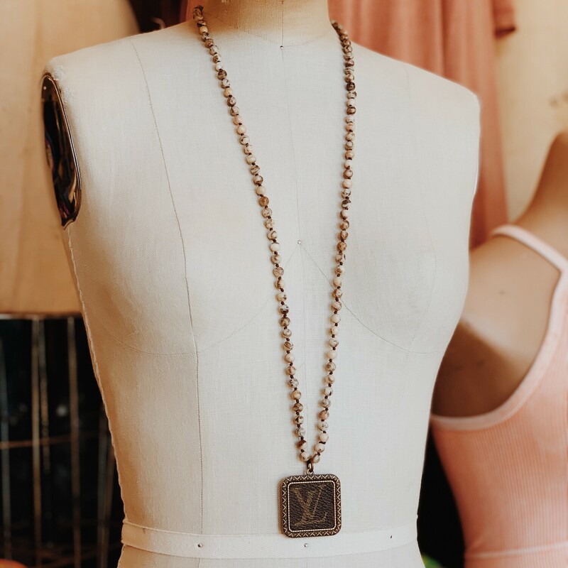 These gorgeous upcycled, handmade necklaces were made from an authentic Louis Vuitton bag!

The chains measure 34 inches in length.

Resurrect Antiques is not affiliated with the LV company.
The bag's date code is SP0927