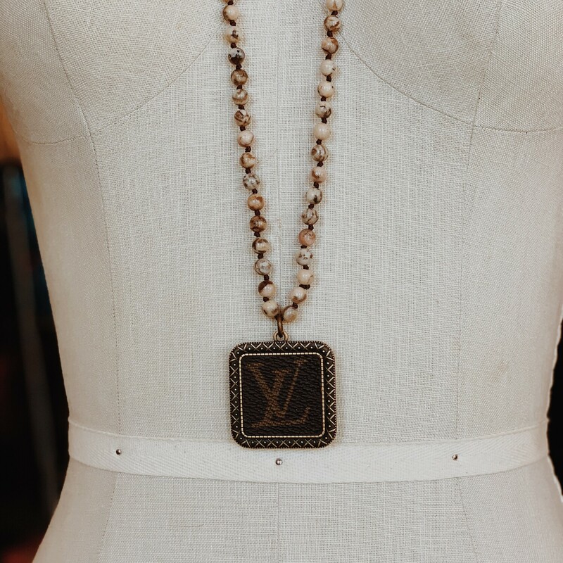 These gorgeous upcycled, handmade necklaces were made from an authentic Louis Vuitton bag!

The chains measure 34 inches in length.

Resurrect Antiques is not affiliated with the LV company.
The bag's date code is SP0927